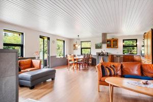 a living room with a couch and a table at 0187-Romo-Egedesminde-1 in Høm