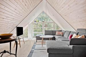 a living room with a couch and a table at 0314-Romo-Kliren-3 in Høm