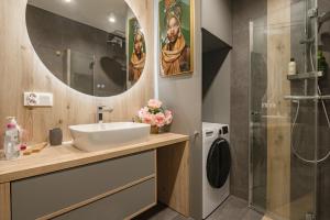 a bathroom with a sink and a shower at Apartament Sun&City in Bielsko-Biała +12 photos