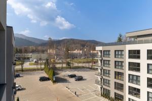 a view of a parking lot from a building at Apartament Sun&City in Bielsko-Biała