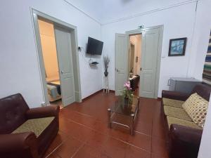 a living room with two couches and a table at Casa Dona Joaquina in Reguengos de Monsaraz