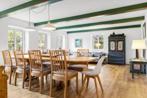 a dining room with a table and chairs at 2804-Romo-Bornholmervej-4 in Høm