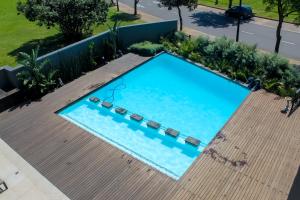 an overhead view of a swimming pool in a yard at The Millennial, Secure parking, 3 mins to Gateway in Durban