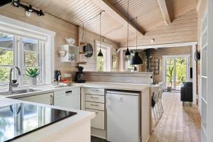 a kitchen with a sink and a counter top at 0311-Romo-Strandskaden-10 in Høm +32 photos