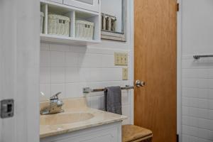 a bathroom with a sink and a mirror at Serendipity -- Hot Tub - Pet Friendly - Fire Pit - Grill - Porch - Deck - Wifi - Pool Access - Games in Berkeley Springs +58 photos
