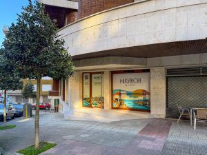a high off store with a tree in front of it at Studios Mugakoa By Sahats in Portugalete