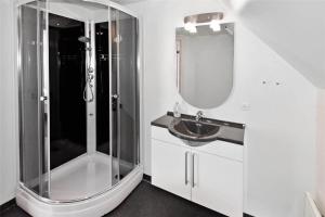 a white bathroom with a shower and a sink at 0230-Romo-Havnebyvej-61-E in Høm +15 photos