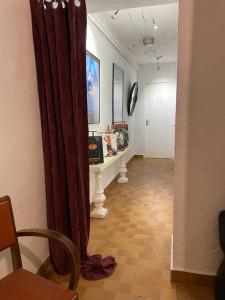 a hallway with a curtain in a room at La suite Galerie d'ART in Céret