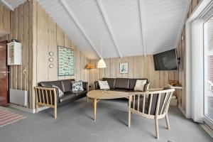 a living room with a couch and a table at 0389-Romo-Vestergade-3-Ap-77 in Høm