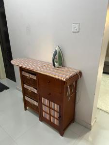 a telephone is sitting on top of a cabinet at Lynch Apartments 2 - Mimosa Chilanga in Lusaka