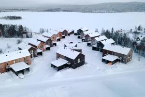 an aerial view of a village covered in snow at Joiku A1 Luxury Chalet in Kolari