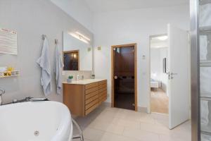 a white bathroom with a sink and a toilet at 0349-Romo-Vestergade-301 in Høm +21 photos