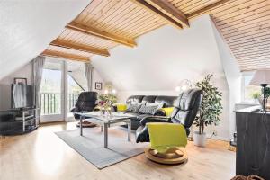 a living room with a couch and a table at 0315-Romo-Dyssebjergvej-49 in Høm