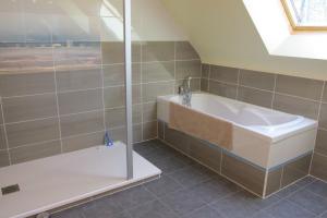 a bathroom with a sink and a shower at Maison moderne Le doux refuge des pêcheurs près de la mer à Cancale 3 étoiles in Cancale +22 photos