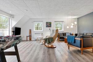 a living room filled with furniture and a table at 0119-Romo-Smafolksvej-43 in Høm