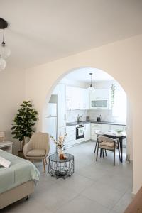 a living room with a couch and a table at Noméa - Modern Apartment Aigio in Aigio