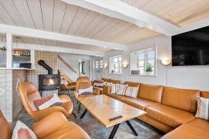 a living room with a couch and a table at 0499-Romo-Vestergade-29 in Høm