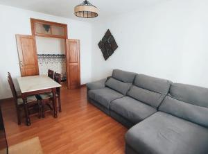 a living room with a couch and a table at Mouraria in Elvas
