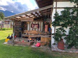 a wooden shed with a table in a yard at Apartment Morgensonne in Piesendorf +17 photos