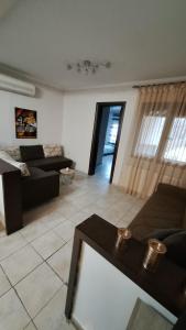 a living room with a couch and a table at Casa Velvet in Potamiá