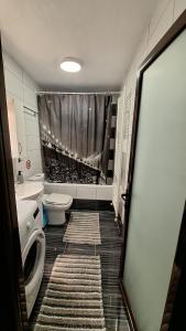 a bathroom with a toilet and a sink and a shower at Casa Velvet in Potamiá +19 photos