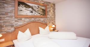 מיטה או מיטות בחדר ב-Davo Lais