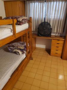 a bedroom with two bunk beds and a window at DaKa in San Bernardo
