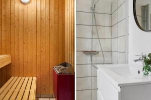 a bathroom with a sink and a shower and a mirror at 2008-Romo-Froidal-10 in Høm +25 photos