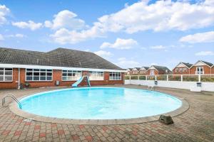 a large swimming pool in front of a building at 0459-Romo-Vestergade-237-App-64 in Høm