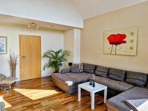 a living room with a couch and a table at Ferienwohnung Am Korretsberg in Kruft +31 photos