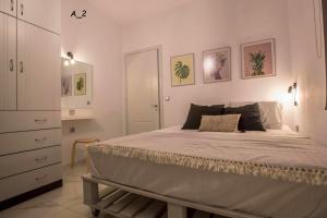 a bedroom with a bed and a dresser at live it _ Karditsa in Karditsa +47 photos