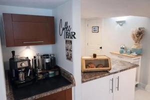 a kitchen with a counter with a coffeemaker on it at Poolside Hideaway Heated Pool All Year Ideal for Groups Sleeps 6 plus in Victoria