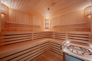 a sauna with wood paneling and a wooden at VILNIUS PARK PLAZA HOTEL & SPA, Restaurant, Conference & Banquet Center in Vilnius