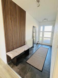 a room with a bench in the corner of a room at Entire Home in Billund Center in Billund