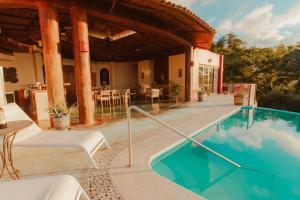 a swimming pool in the middle of a house at Private Cliffside Villa with Infinity Pool in Sayulita