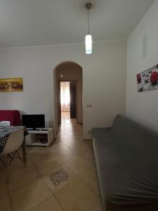 a living room with a couch and a table at Casa Letizia in Lercara Friddi