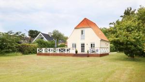 a small white house with an orange roof at 10098-Rorvig-Fjordvaenget-17 in Rørvig