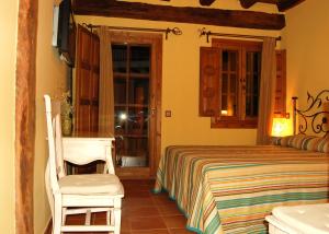 Cama o camas de una habitación en Posada La Gatera