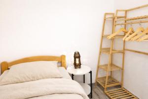 a bedroom with a bed and a book shelf at Ferienwohnung Saupe in Königshain