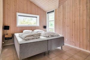 a bedroom with a bed in a room with a window at 14233-Grevinge-Grevinge-Kanalvej-95 in Grevinge