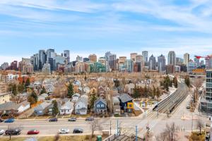 a view of a city skyline with buildings at Stylish Serenity 1BR Kensington Condo wParking in Calgary