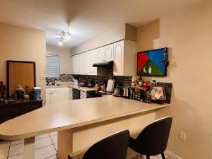 a kitchen with a table and chairs in it at Townhouse 2 bed 2 bath neat and comfy in Gainesville