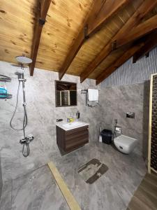 a bathroom with a sink and a toilet at Bait Ajloun in Khirbat Shīn +26 photos