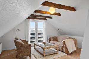 a living room with a couch and a table at LF11975-Struer-Havstokken-12 in Vemb