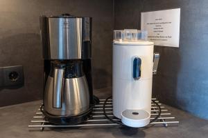 a coffee maker sitting on top of a counter at Studio Relax in Büsum