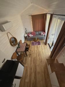an overhead view of a living room in a tent at Domek w górach Tiny House Forest Jacuzzi/widoki in Lipnica Wielka +8 photos