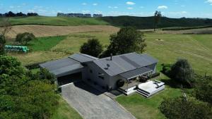 an overhead view of a house in a field at The King's Rest in Matamata