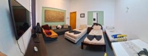 a living room with a couch and a table at Santa Ceciliers in São Paulo