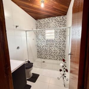 a bathroom with a shower and a sink and a toilet at Casa 2 - Top Country Ranch in Boituva