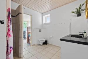 a white bathroom with a toilet and a sink at BV262-Billum-Ho-Bugt-Vej-6 in Billum +37 photos
